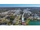 Aerial view of a residential neighborhood near a lake, highlighting the home's location at 1484 Gladys Cir, Dunedin, FL 34698