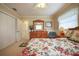 Cozy bedroom with floral bedding, a wooden dresser and ample closet space at 1484 Gladys Cir, Dunedin, FL 34698