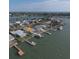 Breathtaking aerial view of a coastal property, featuring a private dock with ocean access at 16125 4Th E St, Redington Beach, FL 33708