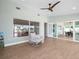 Spacious living room with sliding glass doors and water views at 16125 4Th E St, Redington Beach, FL 33708