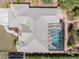 Overhead view of a house with a screened pool, offering privacy and outdoor entertainment space at 182 Rotonda N Blvd, Rotonda West, FL 33947