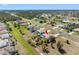 Expansive aerial view of home featuring a screened pool, landscaping and nearby community at 182 Rotonda N Blvd, Rotonda West, FL 33947