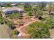 Landscaped backyard featuring a screened lanai and pool area, perfect for outdoor relaxation at 182 Rotonda N Blvd, Rotonda West, FL 33947