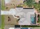 Backyard with a screened pool, surrounded by lush landscaping, offering a private oasis at 182 Rotonda N Blvd, Rotonda West, FL 33947