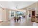 Cozy dining area with tile flooring and sliding glass doors to the outdoor pool at 182 Rotonda N Blvd, Rotonda West, FL 33947
