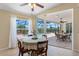 Cozy dining area with view of screened pool through sliding glass doors, offering seamless indoor/outdoor living at 182 Rotonda N Blvd, Rotonda West, FL 33947