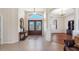 Inviting front entrance featuring double doors, decorative tile, and views into the home's interior at 182 Rotonda N Blvd, Rotonda West, FL 33947