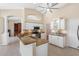 Bright kitchen featuring white cabinets, granite countertops, stainless steel appliances, and a breakfast bar at 182 Rotonda N Blvd, Rotonda West, FL 33947