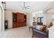 Elegant living room with tile floors, showcasing the entryway with double doors, creating a grand welcome at 182 Rotonda N Blvd, Rotonda West, FL 33947