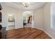 Spacious living room area with hardwood flooring, columns, and natural light at 182 Rotonda N Blvd, Rotonda West, FL 33947