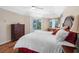 Bright main bedroom features wood floors, ample light, and an exit to the pool area at 182 Rotonda N Blvd, Rotonda West, FL 33947