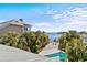 A high angle view of a pool and adjacent dock along a canal at 249 Shore Dr, Palm Harbor, FL 34683