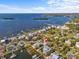 This aerial view shows waterfront houses with private boat docks and ocean access at 249 Shore Dr, Palm Harbor, FL 34683