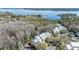Scenic aerial view of a condo complex nestled by a lake, highlighting its tranquil setting and surrounding greenery at 2511 Dolly Bay Dr # 304, Palm Harbor, FL 34684