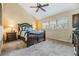 Spacious bedroom with vaulted ceiling, plush carpet, and view of trees through the window at 2511 Dolly Bay Dr # 304, Palm Harbor, FL 34684