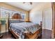 Cozy bedroom featuring a comfortable bed, hardwood floors, and natural light at 2511 Dolly Bay Dr # 304, Palm Harbor, FL 34684