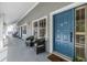 Hallway view with seating and a blue front door with the number 304 at 2511 Dolly Bay Dr # 304, Palm Harbor, FL 34684