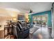 Comfortable living room with dark wood floors, fan, and sliding doors to screened lanai at 2511 Dolly Bay Dr # 304, Palm Harbor, FL 34684