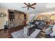 Open-concept living area with a large barn-door entertainment center and staircase views at 2511 Dolly Bay Dr # 304, Palm Harbor, FL 34684