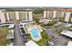 Aerial shot of condo buildings showcasing the swimming pool and carports at 2800 Cove Cay Dr # 3C, Clearwater, FL 33760