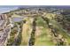 High aerial view of golf course and pond near luxury apartment community with tree lined streets at 2800 Cove Cay Dr # 3C, Clearwater, FL 33760