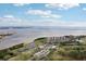 Panoramic aerial shot showcasing waterfront condos, golf course, and a scenic bridge connecting the landscape at 2800 Cove Cay Dr # 3C, Clearwater, FL 33760