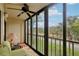 Enclosed lanai with seating and a ceiling fan offering a view of the outside at 2800 Cove Cay Dr # 3C, Clearwater, FL 33760