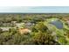 An aerial shot highlighting the community, golf course, and lake at 30 Stanton Cir, Oldsmar, FL 34677