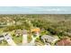 An aerial view shows the property's landscaping and sprawling neighborhood at 30 Stanton Cir, Oldsmar, FL 34677