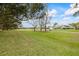 Beautiful backyard with a view of the golf course and a well-maintained lawn at 30 Stanton Cir, Oldsmar, FL 34677