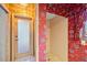 Bathroom showcasing a walk-in shower with floral wallpaper accents and patterned floor at 30 Stanton Cir, Oldsmar, FL 34677