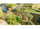 Aerial view of event space and tent located on manicured lawn along the water at 30 Stanton Cir, Oldsmar, FL 34677