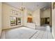 Open foyer features tile floors, chandelier, high ceilings, and large windows at 30 Stanton Cir, Oldsmar, FL 34677