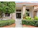 Beautiful home featuring manicured landscaping, brick accents, and a welcoming double-door entrance at 30 Stanton Cir, Oldsmar, FL 34677
