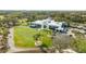 Aerial view of Golf Club featuring pristine green and the main club building at 30 Stanton Cir, Oldsmar, FL 34677