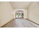 Spacious living room with glass doors leading to the outdoors at 30 Stanton Cir, Oldsmar, FL 34677