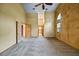 Large main bedroom featuring vaulted ceilings, textured walls, and two entry doors at 30 Stanton Cir, Oldsmar, FL 34677