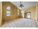 This main bedroom features textured walls, vaulted ceilings, and a sliding glass door at 30 Stanton Cir, Oldsmar, FL 34677