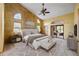 A styled main bedroom with textured walls and a sliding door to the outdoor space at 30 Stanton Cir, Oldsmar, FL 34677