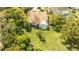 Stunning pool home featuring a spacious backyard, covered patio, and lush landscaping at 30 Stanton Cir, Oldsmar, FL 34677