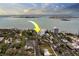 Aerial view of a waterfront condo with beautiful blue water views and lush tropical landscaping at 30 Turner St # 203, Clearwater, FL 33756