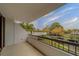 A balcony with railings overlooking a street and neighborhood at 30 Turner St # 203, Clearwater, FL 33756