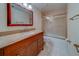 Bathroom features vanity with granite countertop and a glass shower at 30 Turner St # 203, Clearwater, FL 33756