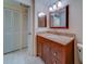 Bathroom features granite countertop and a mirrored wall cabinet at 30 Turner St # 203, Clearwater, FL 33756