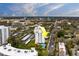 The exterior elevation displays the condo's distance to the beach and covered parking spaces at 30 Turner St # 203, Clearwater, FL 33756