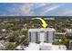 An exterior elevation of the condo building featuring private balconies and a community pool at 30 Turner St # 203, Clearwater, FL 33756