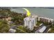 An exterior elevation of the condo building featuring private balconies and reserved parking at 30 Turner St # 203, Clearwater, FL 33756