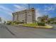 A multi-story condominium building is beautifully landscaped and easily accessible to a road at 30 Turner St # 203, Clearwater, FL 33756