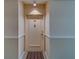 Front door of condo #203 features neutral paint, a peephole, and new hardware at 30 Turner St # 203, Clearwater, FL 33756
