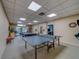 Spacious game room equipped with ping pong table, pool table, and other recreational features at 30 Turner St # 203, Clearwater, FL 33756